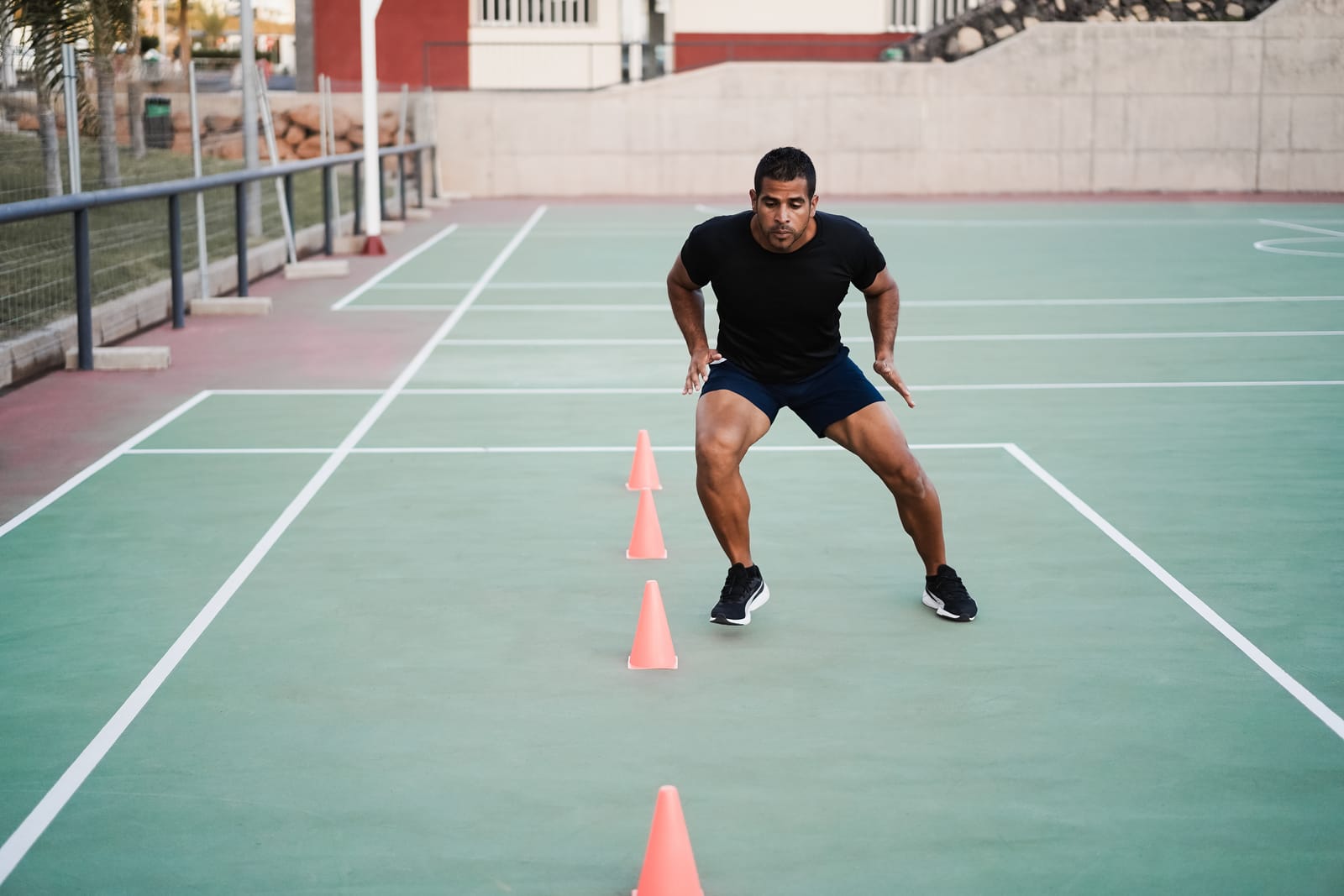 An athlete training through a rhythm of cones