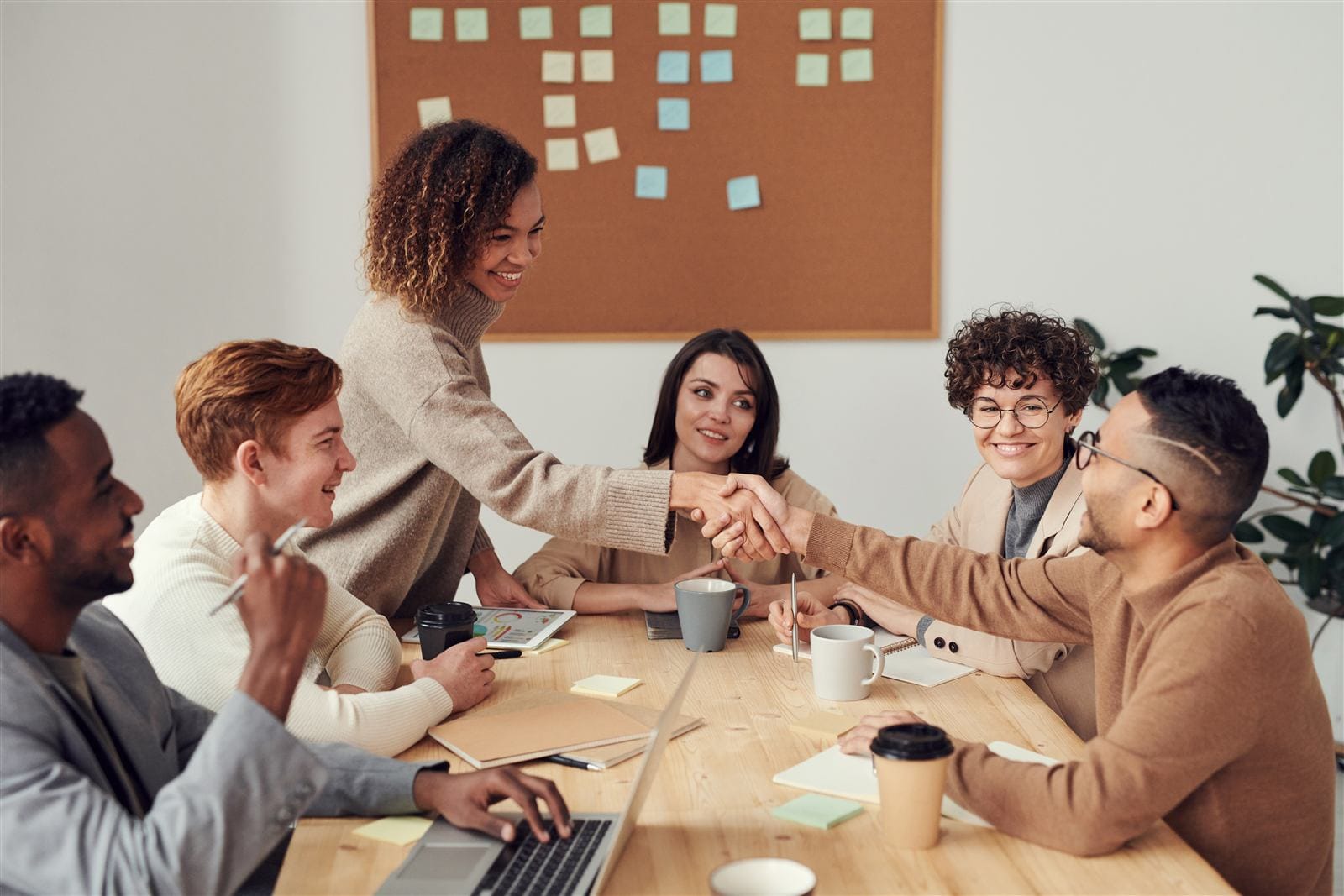 A team in a meeting, working through their cadence together